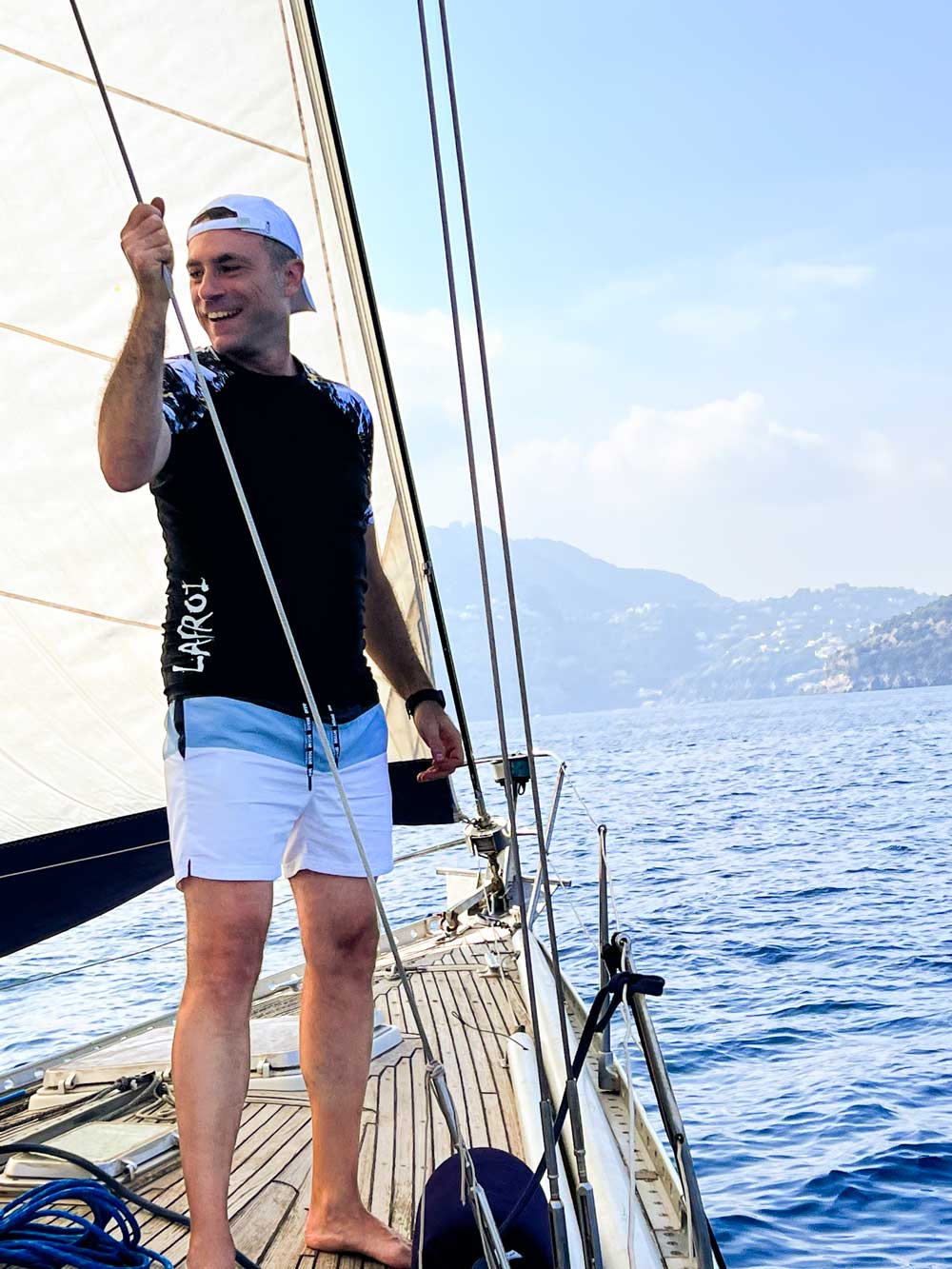 A person at the bow of the Solaris 39 during team building