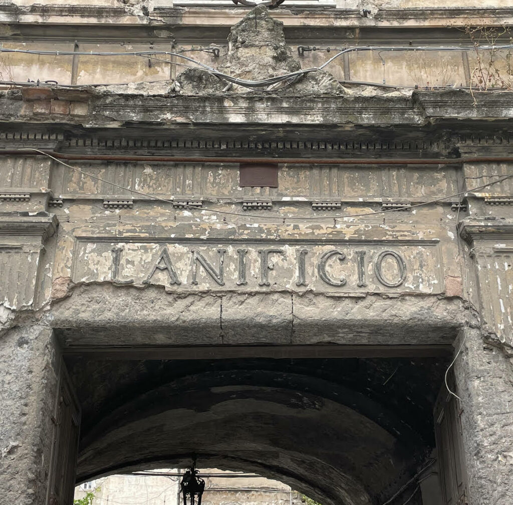The entrance gate bearing the word Lanificio
